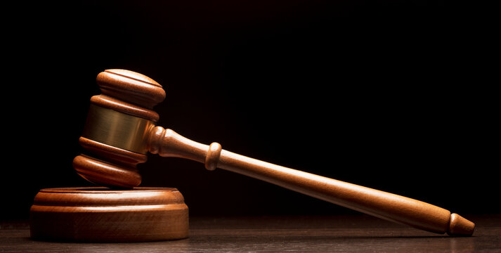 Wooden gavel on black background