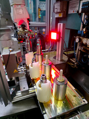 Manufacturing process of precision components in a modern factory setting with automated machinery and sensors