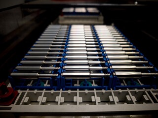 Laboratory equipment displaying multiple tubes organized in a rack for scientific experiments