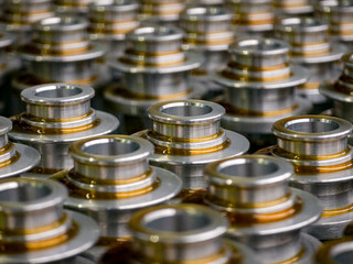 Metal components manufactured in a factory setting showcasing precision engineering