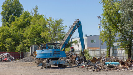 Grappling Hook Crane Loader Machine at Metal Scrap Yard