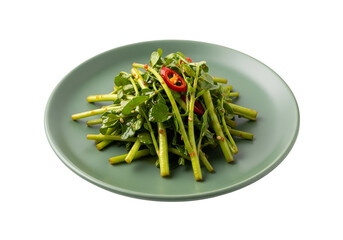 A vibrant, green salad of watercress with chili peppers, presented on a muted sage-green plate against a stark black background.