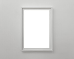 Vertical white frame on a light wall with empty space for artwork, poster, or photo. Minimalist and