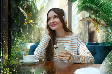 Happy woman listening to sounds of nature which making her feel calm. Double exposure of cafe and tropical island