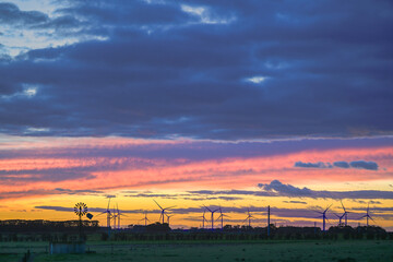 Fototapeta premium Dramatic sunset clouds over the agricultural field, Noorat, Victoria, Australia
