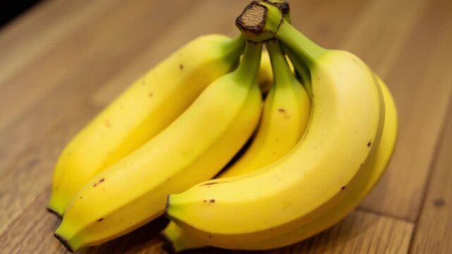 A Fresh Banana resting on a Wooden Table, highlighting its vibrant color and organic nature