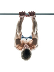 Man hanging from a pullup bar, isolated on transparent background