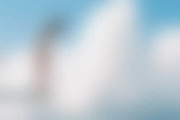 Dreamy abstract background of soft white clouds against a gentle blue sky