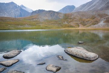 Idyllic summer landscape with hiking trail in the mountains with beautiful fresh green mountain...