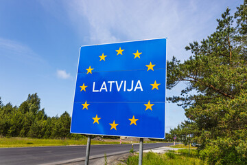 Latvia Border Sign on EU Schengen Entry Road, Blue European Stars, Baltic Route