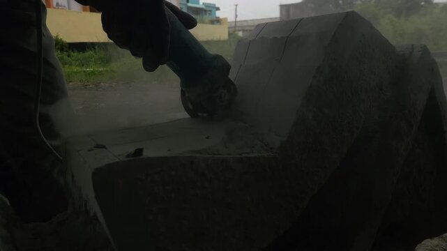 Stone Carving - Stone Art in India. Indian stone mason Creating abstract sculpture Of granite Stone. Cutting rock with grinder, chisel and hammer with traditional technique. Slow Motion 4k Footage