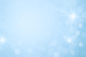 Light blue background with glowing stars and bokeh effect, horizontal photo