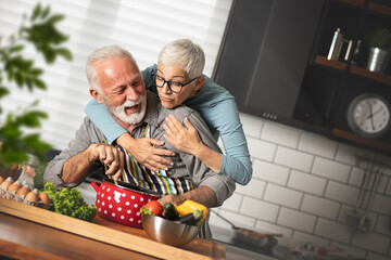 Happiness senior couple cooking together