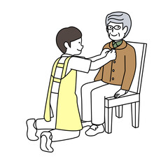 高齢者の着替えを介助する介護士