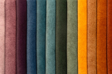 Close-up of fabric color samples for upholstery and interior design, textile swatches for furniture customization, decoration and creative home styling.