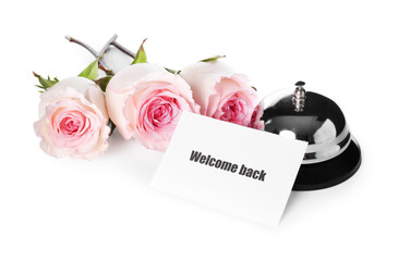 Card with word Welcome, desk bell and roses isolated on white