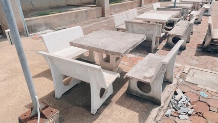 Old broken stone table and bench outdoor furniture