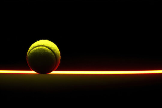 An abstract sports background with a tennis ball and a neon trajectory in the dark. Sport dark background.