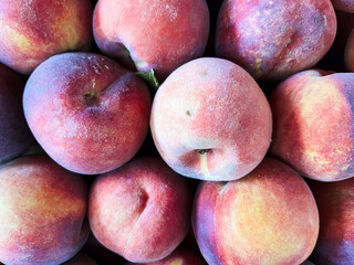 Ripe, juicy peaches are evenly arranged to create a full-frame flat surface, perfect for backgrounds, food projects, desserts, and design compositions.