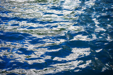 Glittering sea surface under bright sunlight.