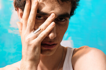 Obraz premium Stylish man exudes charm and elegance against a vibrant backdrop of color