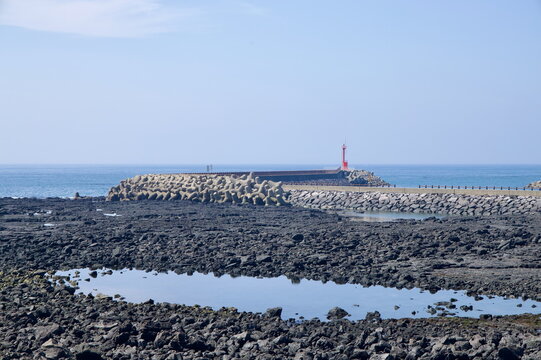 Lighthouse and Tetrapods at Low Tide