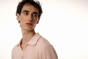 Stylish man exuding elegance and confidence in chic attire against a minimalist backdrop