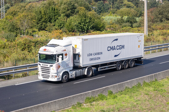 Scania truck hauling cma cgm low-carbon emission container