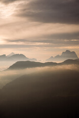 Dolomites Mountains in Morning Mist at Sunrise