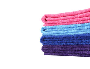 Stack of bright terry towels isolated on white