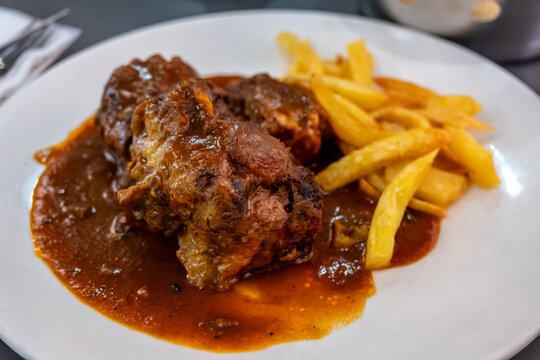 Spanish bull tail stew rabo de toro with potatoes, served in a restaurant in Cordoba, Andaluzia. Spanish bull tail stew rabo de toro, spanish cuisine