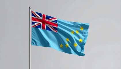 Vibrant Tuvalu flag waves proudly against a clear sky, symbolizing national pride and island heritage.