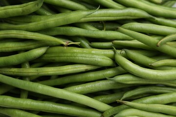 Fresh green bean pods as background, closeup