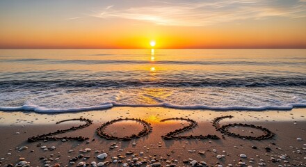Numbers 2020 drawn in the sand on a beach at sunset with waves gently rolling ashore under a clear sky