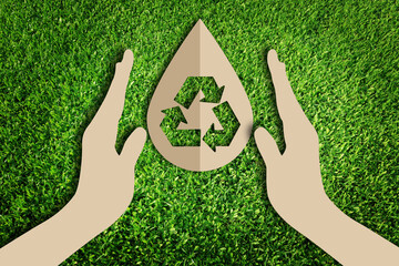  Save water concept. Paper cut of eco on green grass.