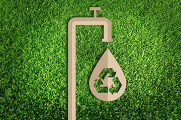  Save water concept. Paper cut of eco on green grass.