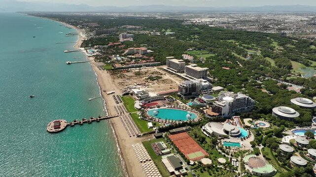 Belek, Turkey - July 15 2025: Aerial view of Calista Luxury Resort Hotel and Spa with swimming pool, sun beds and contemporary round buildings