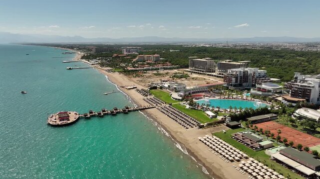 Belek, Turkey - July 15 2025: Aerial view of Calista Luxury Resort Hotel and Spa with swimming pool, sun beds and contemporary round buildings