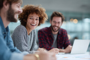 Smiling diverse team collaborating on a project, showcasing teamwork and success. Ideal for business, education, and motivation themes. Authentic, bright, engaging.