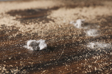 Wooden table covered with dust, closeup view