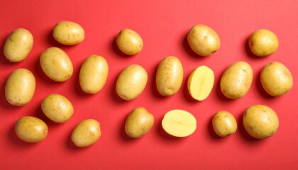 Fresh Yellow Potatoes Arranged on Red Background Clean Healthy Food Concept.