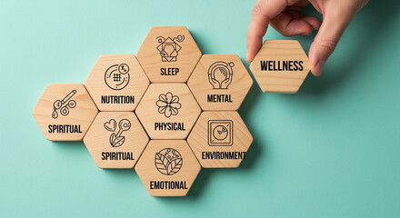 Photo of a hand places the final wellness hexagon tile, completing a mosaic of health concepts like sleep, nutrition, and mental wellbeing