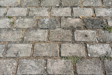 Old dirty stone road, a beautiful background for the designer with empty space