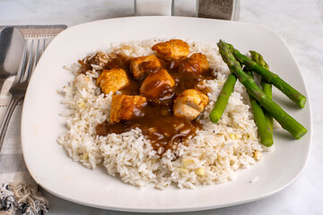 rice with  chicken bites  top with gravy
