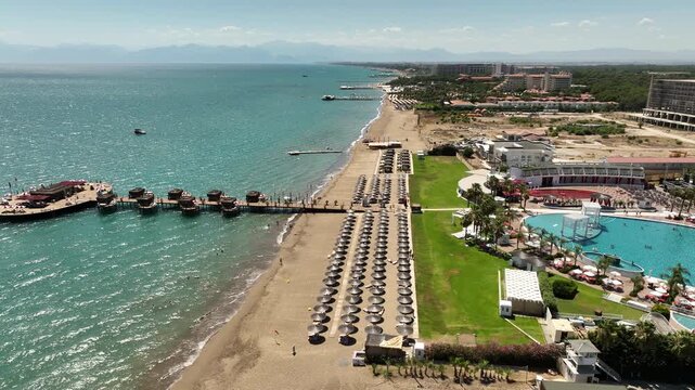 Belek, Turkey - July 15 2025: Aerial view of Calista Luxury Resort Hotel and Spa with swimming pool, sun beds and contemporary round buildings