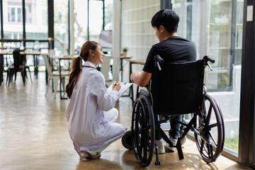 Cropped shot of a female nurse hold her man hand. Giving Support. Doctor helping man with Alzheimer's disease. Female carer holding hands of man
