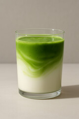 Layered Matcha Latte with Milk Swirl in Glass – Minimalistic Front View