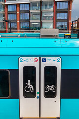 Entrance of a blue train waiting at the station of Harlingen, The Netherlands