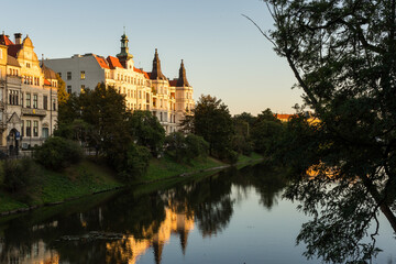 Obraz premium Buildings reflected on the surface of Fosa Miejska in Wrocław