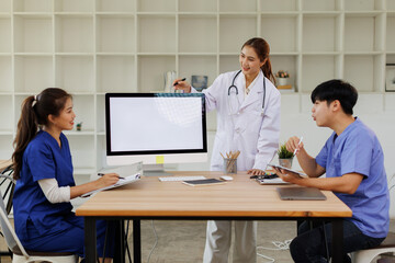 Obraz premium Doctors, nurse and women on desktop computer screen in meeting, collaboration for hospital planning, medical or life insurance. Talking, leadership and healthcare workers on paper in diversity researc